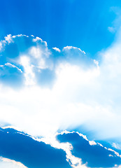 Image showing Sun shinging behind clouds