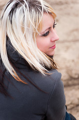 Image showing Beautiful young blonde girl looks back