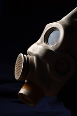 Image showing Closeup of a gasmask with blue dark background