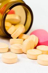 Image showing A bottle of pills on white isolated background