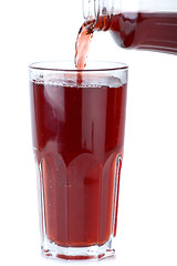 Image showing Glass poured with pomegranate juice