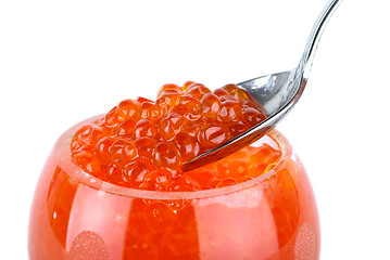 Image showing Small metal spoon and glass bowl with red caviar