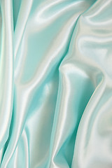 Image showing Smooth elegant blue silk as background 