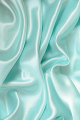 Image showing Smooth elegant blue silk as background 