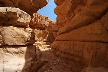 Image showing Narrow slot between two rocks in desert canyon