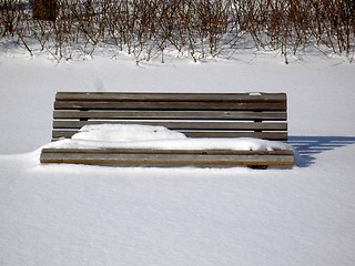 Image showing Snowy bench