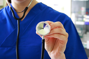 Image showing Female doctor holding stethoscope