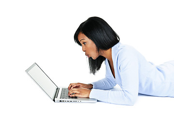 Image showing Surprised woman using laptop computer