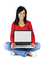 Image showing Young woman holding laptop computer
