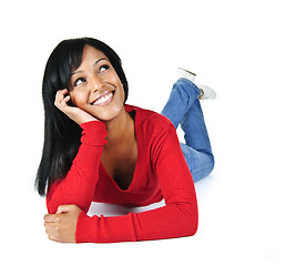 Image showing Smiling young woman relaxing looking up