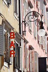 Image showing Street lamp and bar sign