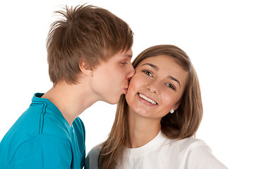 Image showing Boy kisses girl