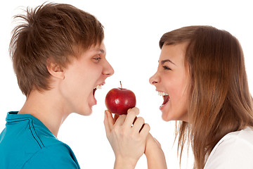 Image showing boy and a girl biting the apple
