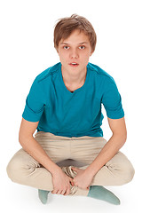 Image showing Teen sits on the floor