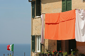 Image showing Flag  and laundry hung on to dry, Corniglia.