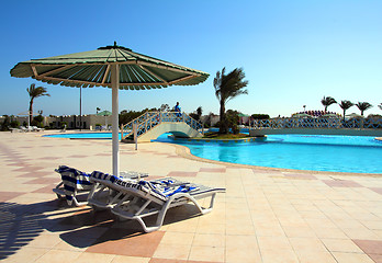 Image showing parasol and swimming pool in hotel