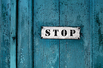 Image showing a sign saying ''stop''on the grunge wooden background