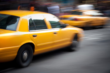 Image showing Speeding Yellow Taxi Cabs Motion Blur