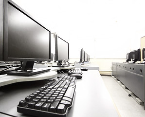 Image showing workplace room with computers in row 