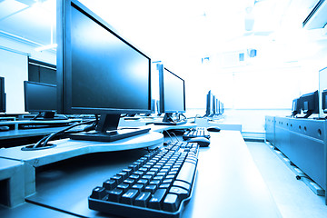 Image showing workplace room with computers in row 