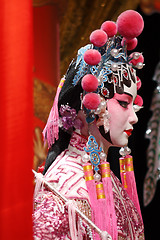 Image showing chinese opera dummy and red cloth as text space ,it is a toy,not