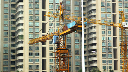 Image showing Building of a skyscraper with two tower cranes 