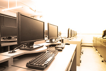 Image showing workplace room with computers in row 