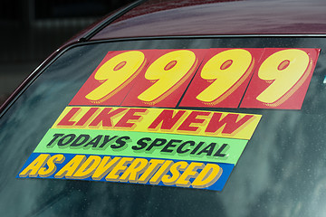 Image showing price sticker on used car lot