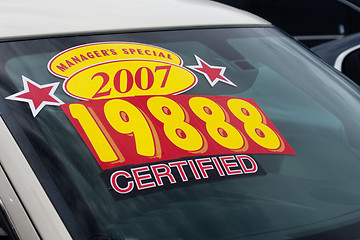 Image showing price sticker on used car lot