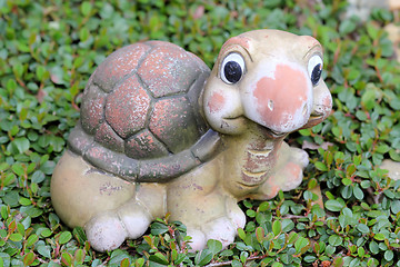 Image showing Decorative turtle figurine in garden