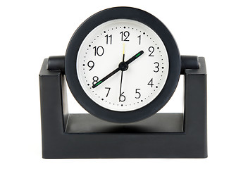 Image showing Desktops mechanical clock in a black plastic casing