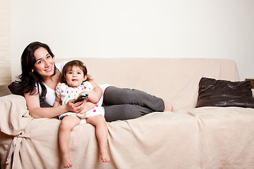 Image showing Mother and daughter watching TV