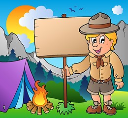 Image showing Scout boy holding board outdoor