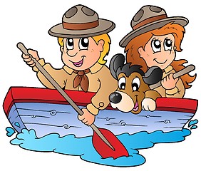 Image showing Wooden boat with scout boy and girl