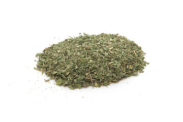 Image showing Pile of dried basil spice isolated