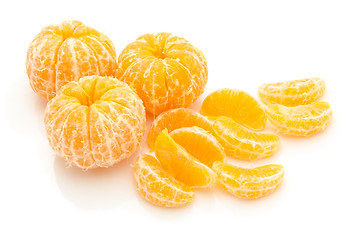 Image showing lices of peeled orange on white