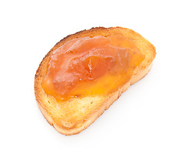 Image showing apricot jam over toast isolated