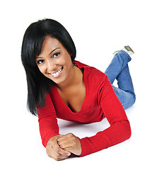 Image showing Young woman smiling laying down