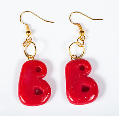 Image showing Earrings in the form of a letter B on a white background