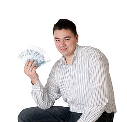 Image showing Happy young man holding a money