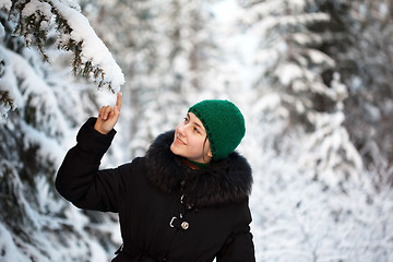 Image showing A girl in a warm fur coat