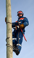 Image showing Electrician on a pole