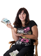 Image showing Happy young girl holding a lot of money