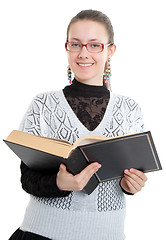Image showing Girl with glasses reading a thick book