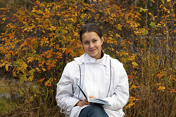 Image showing Young girl with a book