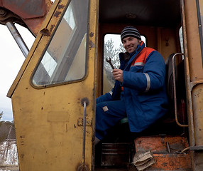 Image showing Machinist excavator with a wrench in his hand