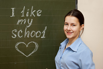 Image showing Girl at a school board