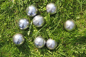 Image showing petanque bowls in the green grass 