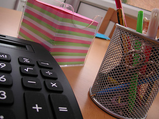 Image showing students calculator and pens with note paper