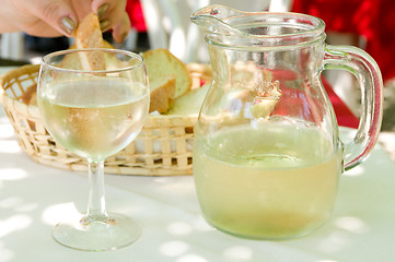 Image showing Glass and bowl of wine.